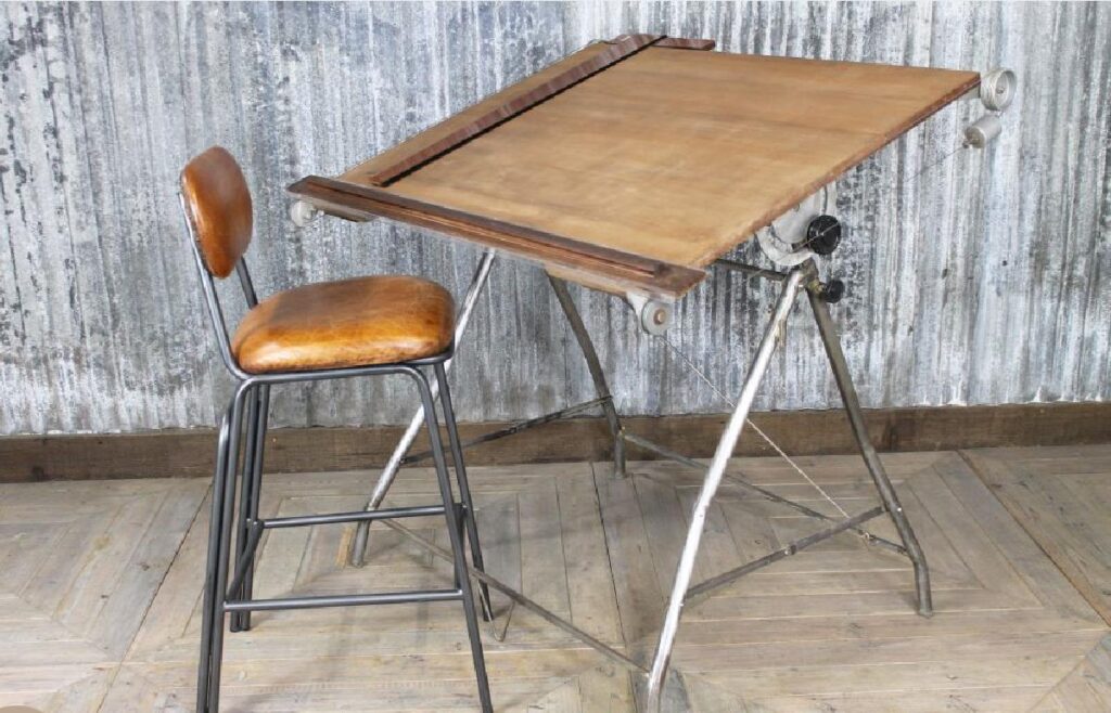 Old-style wooden drafting/drawing board with metal folding legs